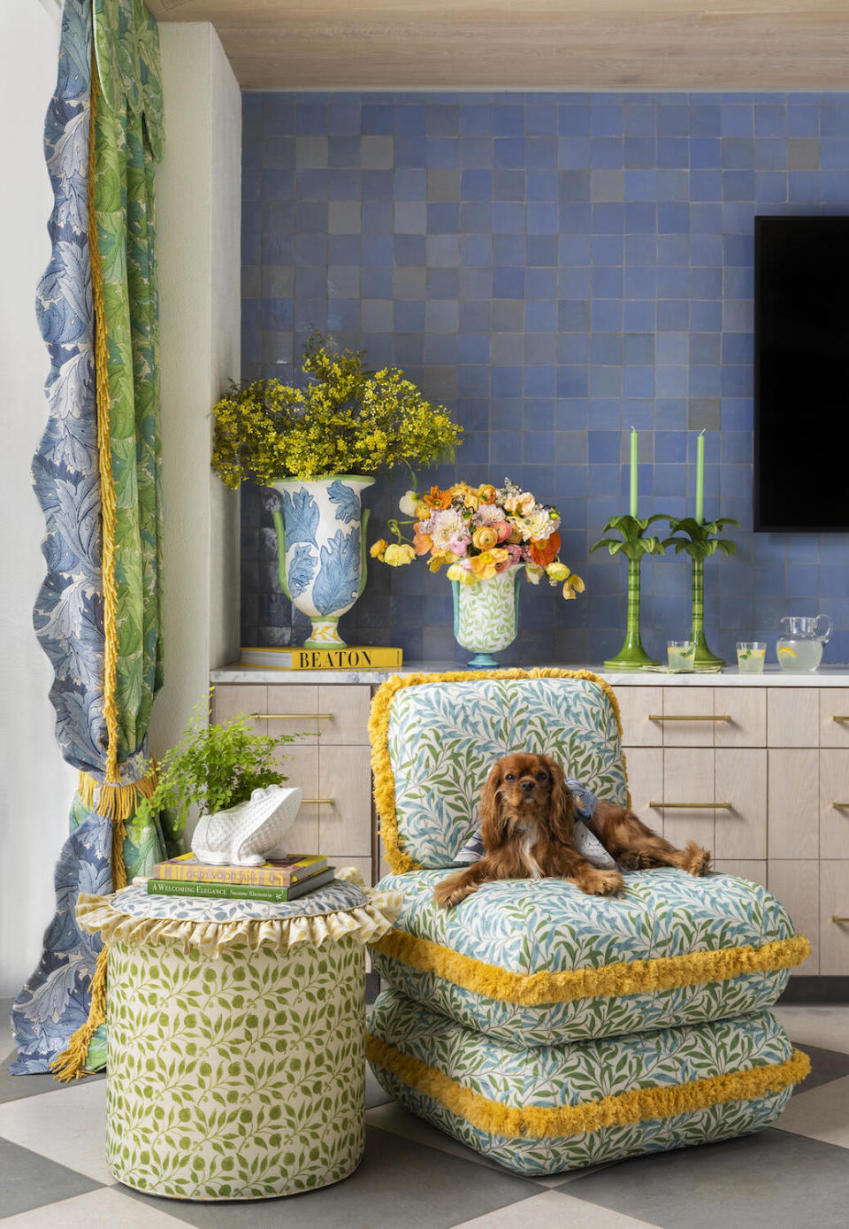 A chair upholstered in Willow Bough in Nettle/Sky Blue and side table in Rosehip in Nettle from the Outdoor-Performance Collection by Morris & Co., styled by Courtnay Tartt Elias of Creative Tonic 