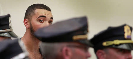 Suspect Emanuel Lopes, 20, looks on during his arraignment in the shooting deaths of Weymouth police officer Michael Chesna and a bystander, in District Courthouse in Quincy, Massachusetts, U.S., July 17, 2018. Pool/Greg Derr/The Patriot Ledger