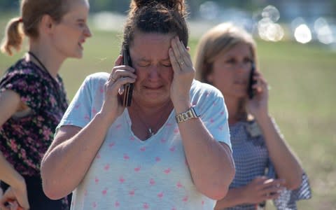 Instructional Assistant Paige Rose reacts outside Noblesville West Middle School - Credit: Getty