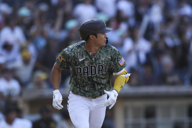 San Diego Padres' Ha-Seong Kim, of South Korea, smiles while taking part in  drills the day before a wild-card baseball playoff game against the New  York Mets, Thursday, Oct. 6, 2022, in