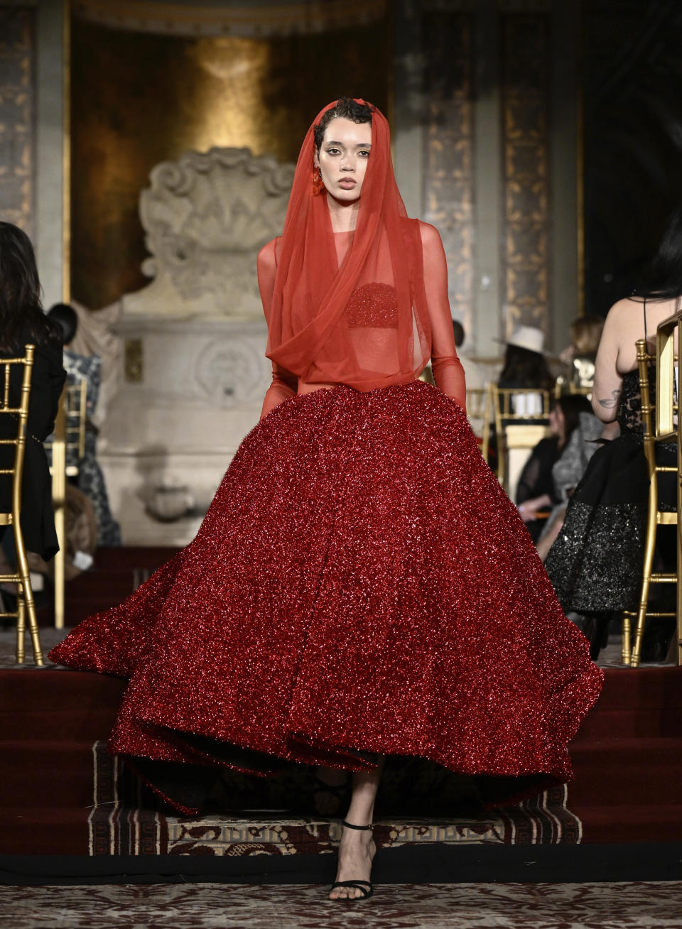 A model walks the runway during the Christian Siriano Fall/Winter 2024 fashion show at The Plaza Hotel during New York Fashion Week on Thursday, Feb. 8, 2024, in New York. (Photo by Evan Agostini/Invision/AP)
