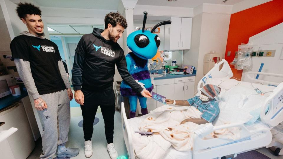 Charlotte Hornets players LaMelo Ball and Vasilije Micic along with Hugo the Hornet visited Novant Health Hemby Children’s Hospital on April 8, 2024. The group went room-to-room delivering and autographing Hugo children’s books and visiting with patients and their families.