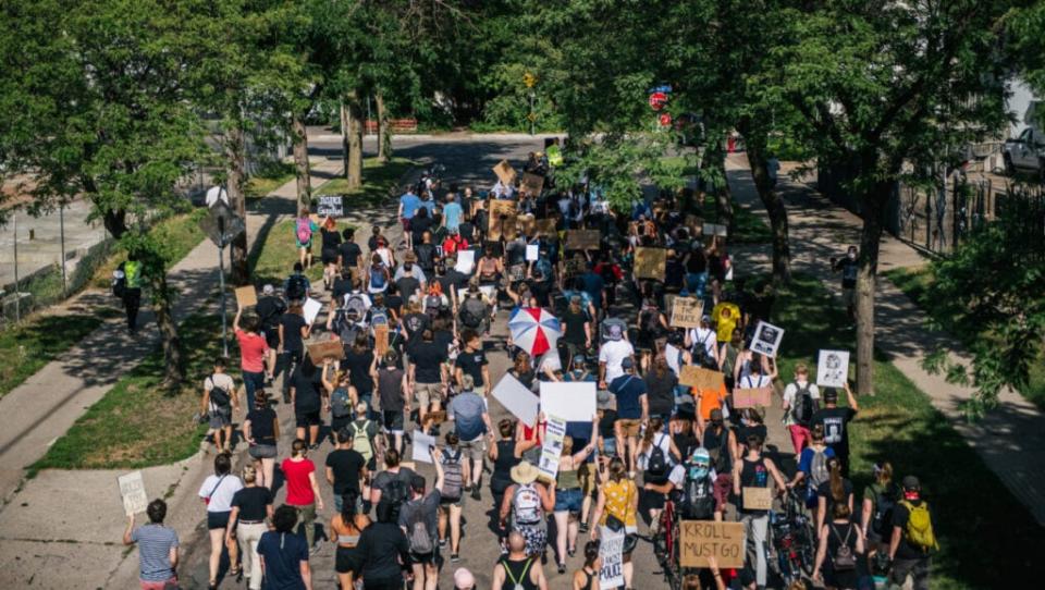 People march in the street during a demonstration on June 25, 2020 in Minneapolis, Minnesota. (Photo by Brandon Bell/Getty Images)