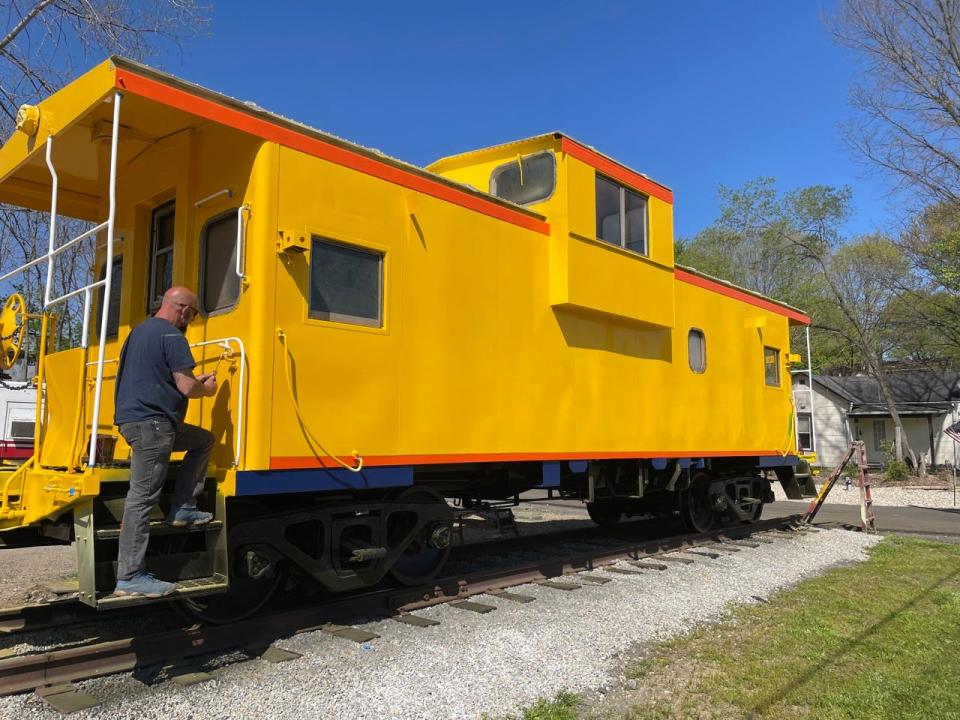 Newly yellow painted Chessie Systems caboose