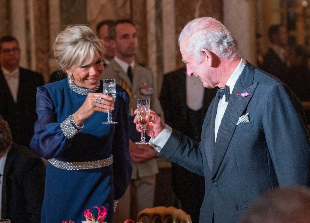 Brigitte Macron and King Charles toast at the state banquet (Getty Images)