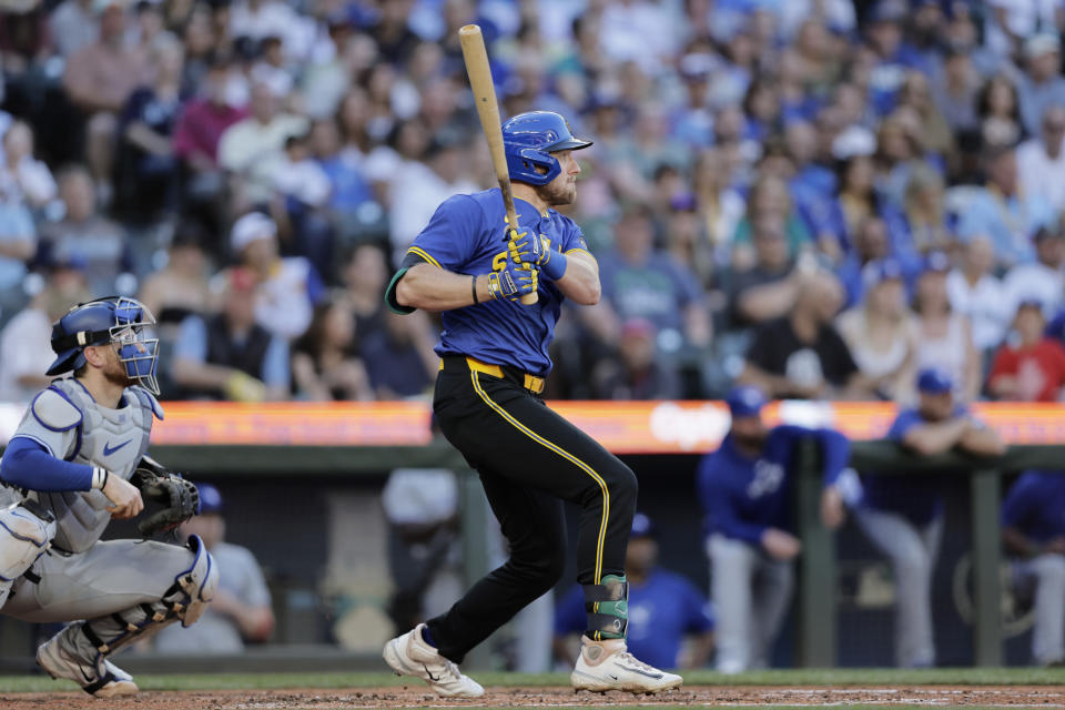 Seattle Mariners' Luke Raley, right, hits a two-RBI double against the Toronto Blue Jays during the third inning in a baseball game, Friday, July 5, 2024, in Seattle. (AP Photo/John Froschauer)