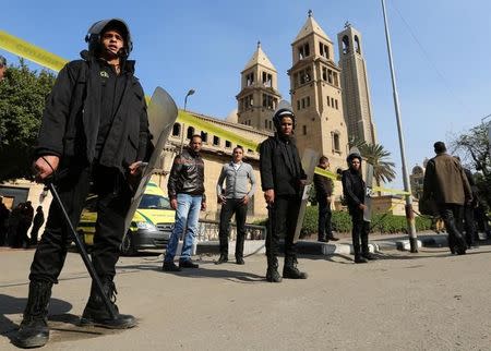 Members of the special police forces stand guard to secure the area around St. Mark's Coptic Orthodox Cathedral after an explosion inside the cathedral in Cairo, Egypt December 11, 2016. REUTERS/Mohamed Abd El Ghany