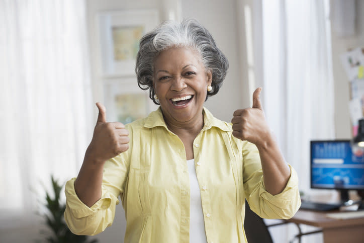 woman with her thumbs up
