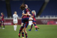 United States' Rose Lavelle, left, celebrates after scoring a goal during a women's soccer match against New Zealand at the 2020 Summer Olympics, Saturday, July 24, 2021, in Saitama, Japan. (AP Photo/Martin Mejia)