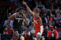 Houston Rockets guard Jalen Green (4) signals after making a 3-point shot, next to Sacramento Kings forward Chimezie Metu (7) during the first half of an NBA basketball game Wednesday, Feb. 8, 2023, in Houston. (AP Photo/Michael Wyke)