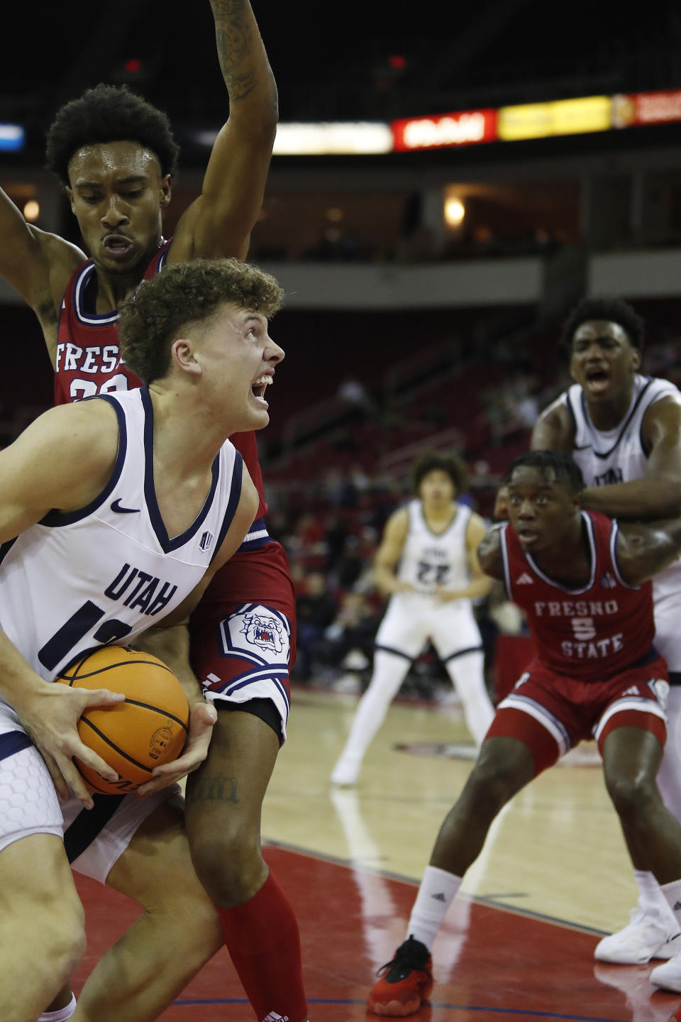 Utah State's Mason Falslev goes up strong against Fresno State's Leo Colimerio during the first half of an NCAA college basketball game in Fresno, Calif., Tuesday, Feb. 27, 2024. (AP Photo/Gary Kazanjian)