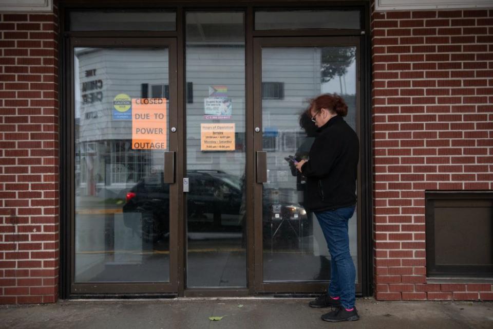 A worker arrives at a grocery store to help empty the freezers after the store lost power during post-tropical cyclone Lee in St. Andrews, New Brunswick, Canada, on Saturday.