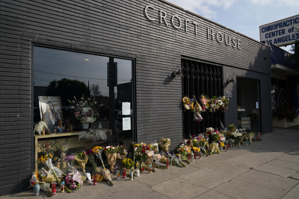 Flowers and candles are placed outside Croft House store in honor of Brianna Kupfer on Tuesday, Jan. 18, 2022, in Los Angeles. The Los Angeles Police Department, West Bureau Homicide detectives are investigating the murder of Kupfer, a 24-year-old Pacific Palisades resident, who was killed at a business in the 300 block of North La Brea Avenue on Jan. 13. (AP Photo/Ashley Landis)