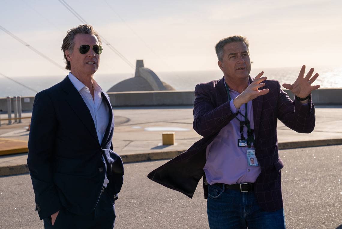 California Gov. Gavin Newsom, left, listens to Tom Jones, PG&E’s director of government relations, during a tour of Diablo Canyon nuclear power plant in Avila Beach on March 1, 2023.