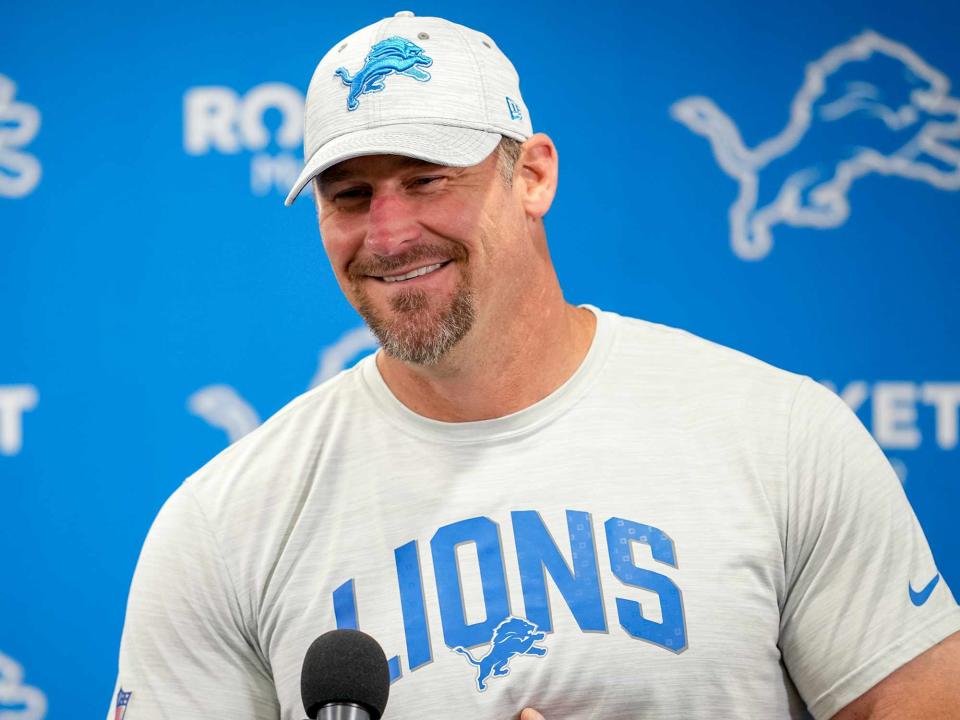 <p>Nic Antaya/Getty </p> Dan Campbell answering questions from reporters during the Detroit Lions Training Camp at the Lions Headquarters and Training Facility on July 29, 2022.