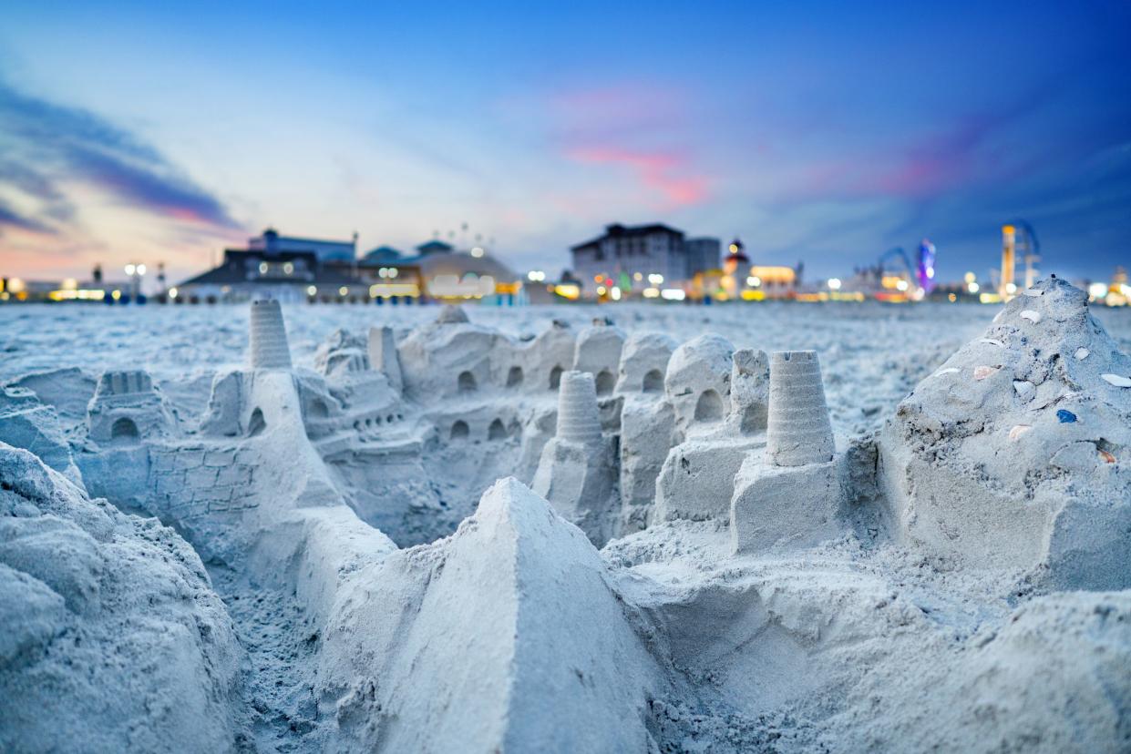 Sand castles with the lights of the Boardwalk in the background, Ocean City, New Jersey