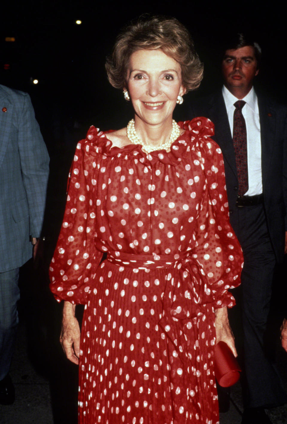 Nancy Reagan in a red polka dot dress and pearls in the 1980s