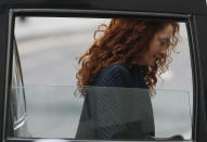 Rebekah Brooks, former News International chief executive, arrives at the Central Criminal Court in London where she appear to face charges related to phone hacking, Wednesday, Feb. 19, 2014. Almost four months into her trial, Brooks is finally getting her day in court. After watching in silence from the dock as her alleged crimes were dissected, the 45-year-old former newspaper editor, once Rupert Murdoch's top British lieutenant, is expected to take the stand to rebut charges of phone hacking, bribery and obstructing a police investigation. (AP Photo/Sang Tan)