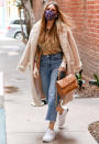 <p>Sofía Vergara puts on a cozy coat before stepping out in Beverly Hills to run errands on Dec. 27.</p>