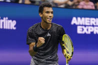 Felix Auger-Aliassime, of Canada, reacts after winning the third set against Frances Tiafoe, of the United States, during the fourth round of the US Open tennis championships, Sunday, Sept. 5 2021, in New York. (AP Photo/Frank Franklin II)