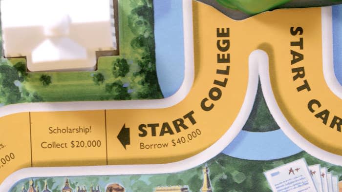 Life boardgame with square that says start college, borrow $40,000