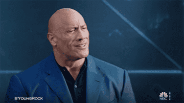 The Rock nodding and patting his chest