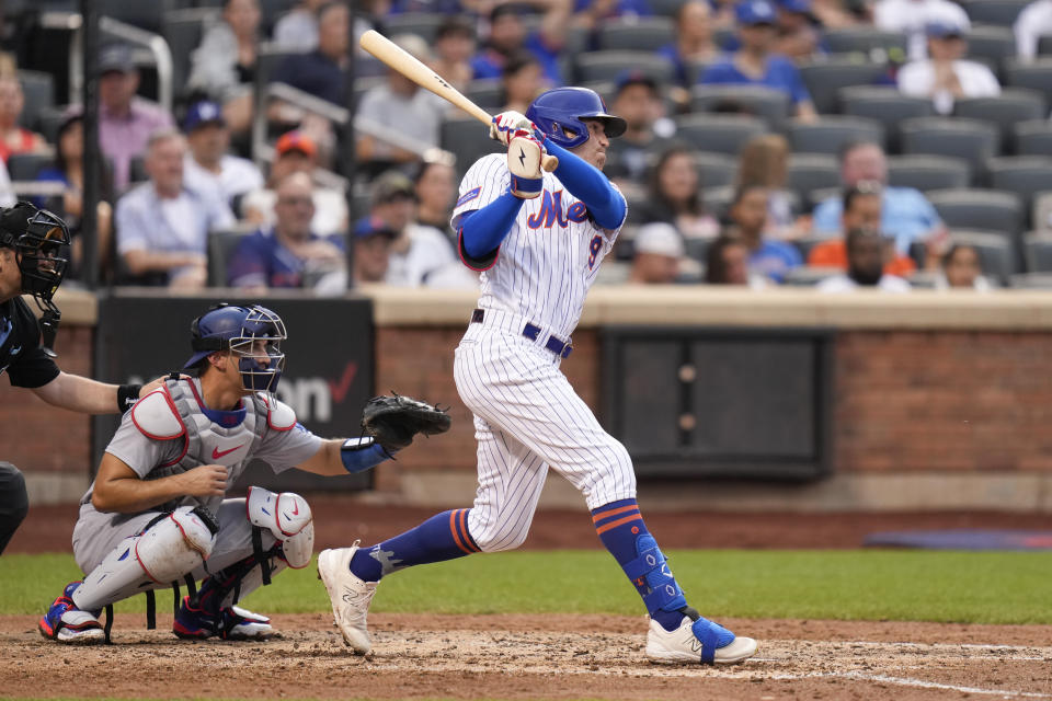 New York Mets' Brandon Nimmo, right, grounds out but Starling Marte scored during the fifth inning of a baseball game against the Los Angeles Dodgers at Citi Field, Sunday, July 16, 2023, in New York. (AP Photo/Seth Wenig)