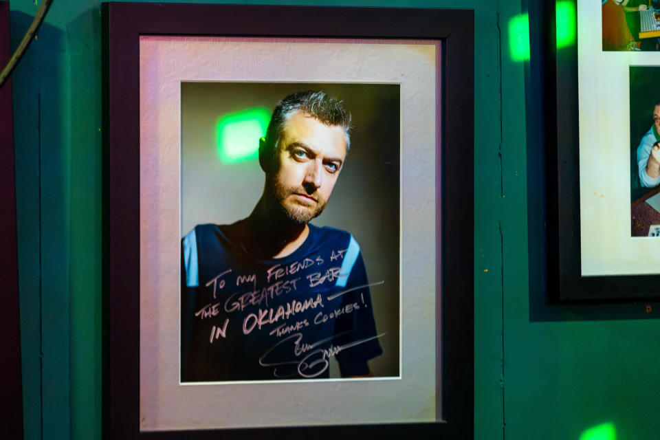 A signed photo of actor Sean Gunn hangs on the wall on the set of "Defiant Vanity" during filming at Cookies on Western in Oklahoma City on Friday, June 30, 2023.