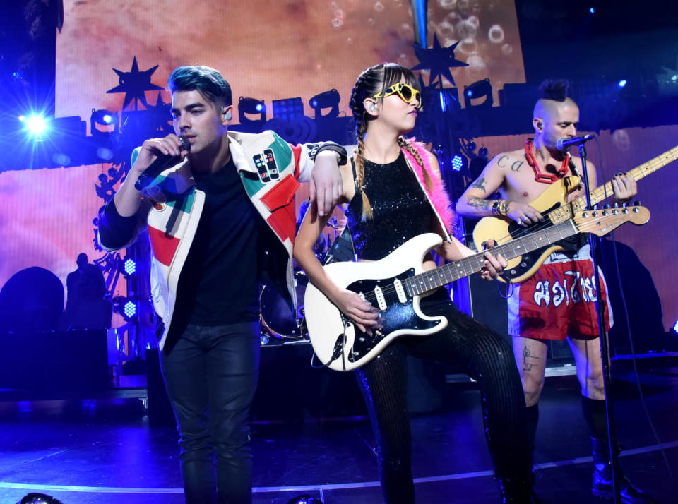 <p>Joe Jonas and his band traded their AMA matching outfits for quirkier fare last night. <i>Photo: Getty</i></p>