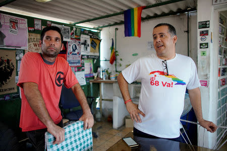 Gay rights activists Isbel Diaz Torres (R) and Jimmy Roque Martinez, speak during an interview in Havana, Cuba, May 7, 2019. REUTERS/Alexandre Meneghini