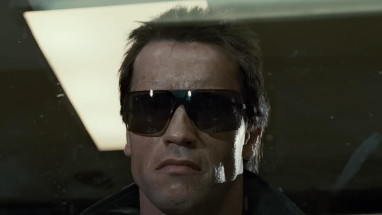  Arnold Schwarzenegger menacingly stands behind plexiglas in The Terminator. 