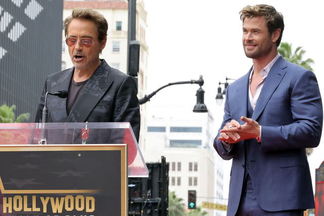 <p>Kevin Winter/Getty</p> Robert Downey Jr. and Chris Hemsworth on May 23, 2024