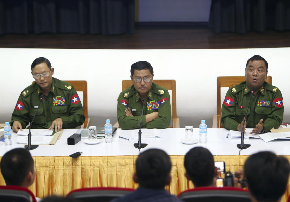 Maj. Gen.Nyi Nyi Tun, vice chairman of the Myanmar's military information committee, left, Maj. Gen. Soe Naing Oo, chairman of the Myanmar's military information committee, center, and Brig. Zaw Min Tun, secretary of the Myanmar's military information committee, attend a press conference at the Military Museum in Naypyitaw, Myanmar, Friday, Jan. 18, 2019. (AP Photo/Aung Shine Oo)