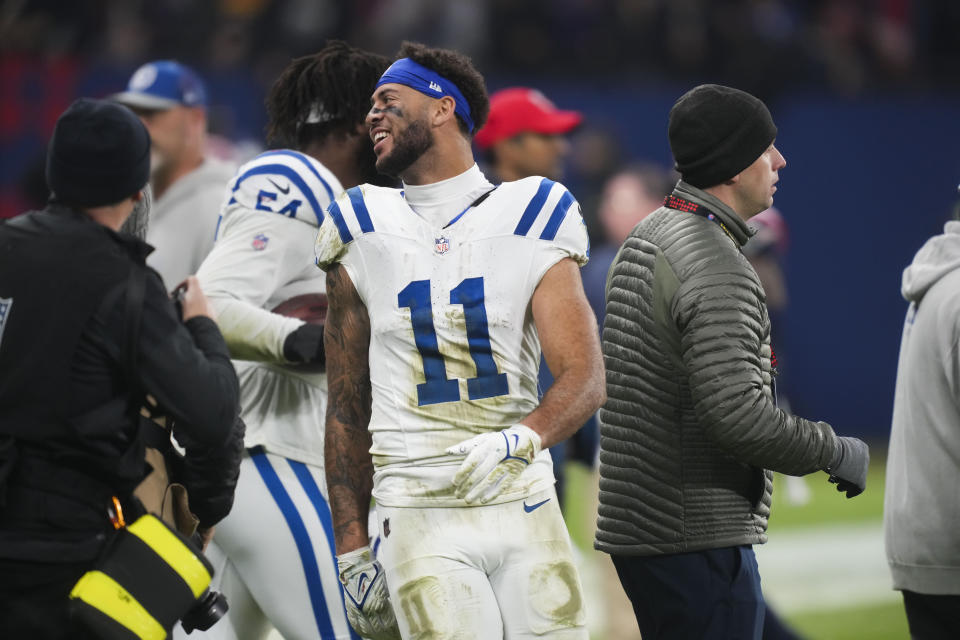 Indianapolis Colts wide receiver Michael Pittman Jr. (11) celebrates after an NFL football game against the New England Patriots in Frankfurt, Germany Sunday, Nov. 12, 2023. The Colts won 10-6. (AP Photo/Michael Probst)