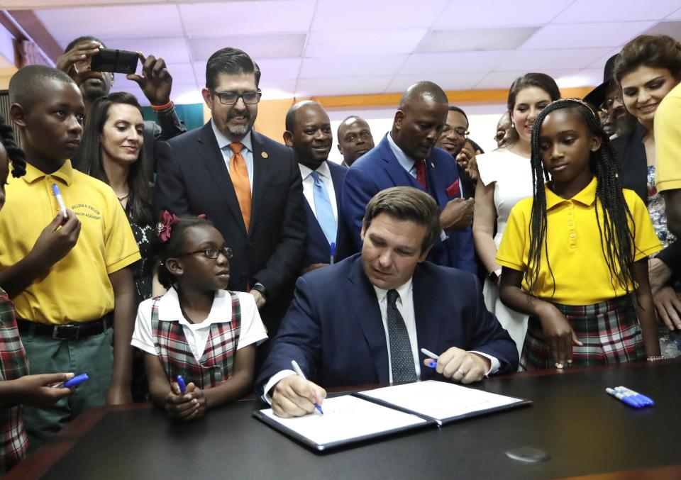 Gov. Ron DeSantis signs bill that expanded school voucher programs in Florida. The long term impact? A boon for private schools and a drain on public education in Florida.