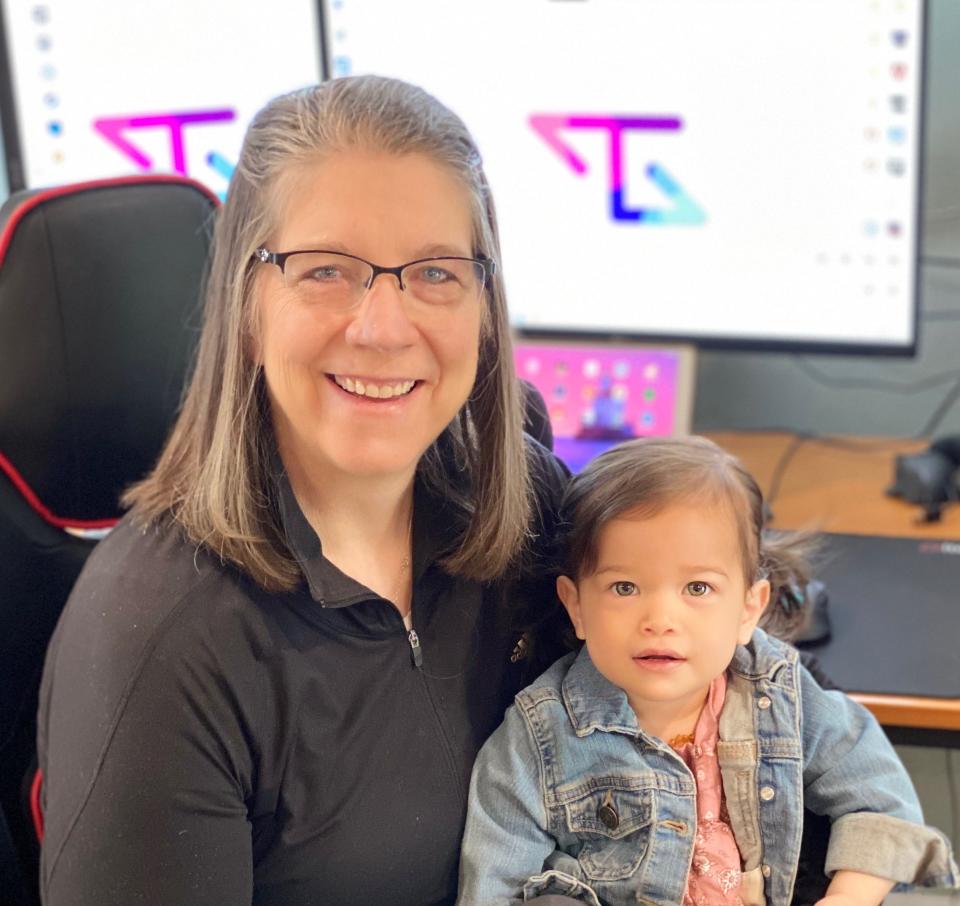 Michelle Statham, known to her TikTok followers as 'Tactical Gramma,' poses for a photo with one of her grandkids.