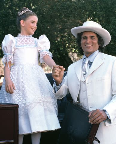 <p>NBCU Photo Bank/NBCUniversal via Getty</p> Pictured: (l-r) Melissa Gilbert as Laura Elizabeth Ingalls, Michael Landon as Charles Philip Ingalls.