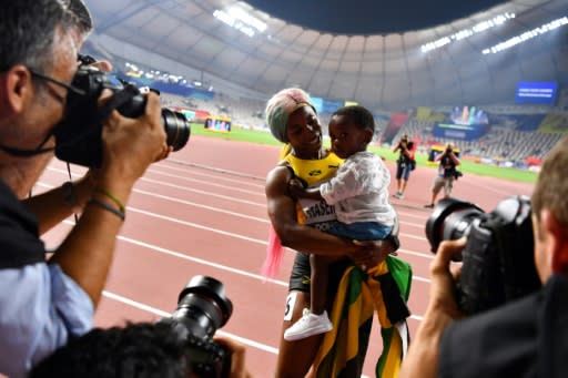 Jamaican sprint legend Shelly-Ann Fraser-Pryce celebrated her fourth women's 100 metres world title with her two-year-old son Zyon