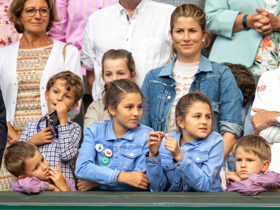 Mirka Federer, wife of Roger Federer with their children nine-year-old twin girls Charlene and Myla and five-year-old boys Lenny and Leo during presentations after Roger Federer of Switzerland loss against Novak Djokovic of Serbia during the Men's Singles Final on Centre Court during the Wimbledon Lawn Tennis Championships at the All England Lawn Tennis and Croquet Club at Wimbledon on July 14, 2019 in London, England