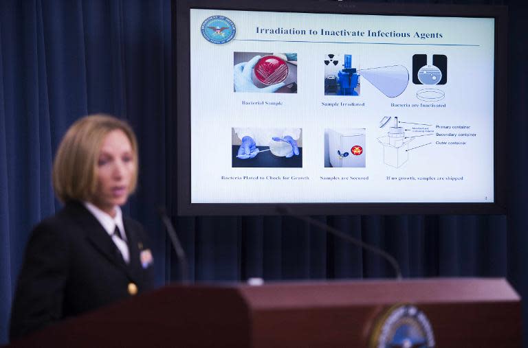 Director of Medical Programs for DoD Chemical and Biological Defense Commander Franca Jones speaks as a graphic shows how Irradiation to Inactivate Infectious Agents is completed during a media briefing at the Pentagon in Washington, DC, June 3, 2015