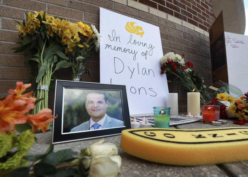 The pop-up memorial for slain Spectrum News 13 journalist Dylan Lyons is shown at the University of Central Florida Nicholson School of Communications in Orlando, Fla., Thursday, Feb. 23, 2023. Lyons, a graduate of UCF, was shot and killed while covering a homicide in Orlando on Wednesday. (Joe Burbank /Orlando Sentinel via AP)