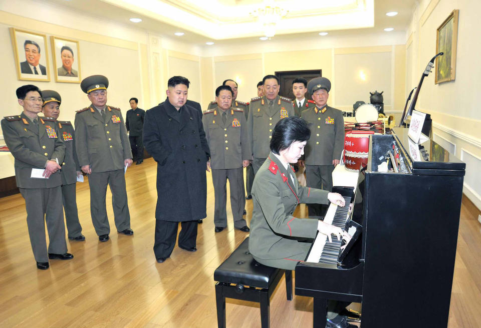 This undated photo released by North Korea's official Korean Central News Agency &nbsp;via the Korean News Service on March 25, 2013 shows North Korean leader Kim Jong-Un (4th from L) watching a pianist playing during an inspection at an undisclosed location in North Korea.