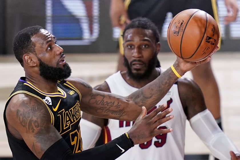 The Lakers' LeBron James drives to the basket during Friday's Game 5.