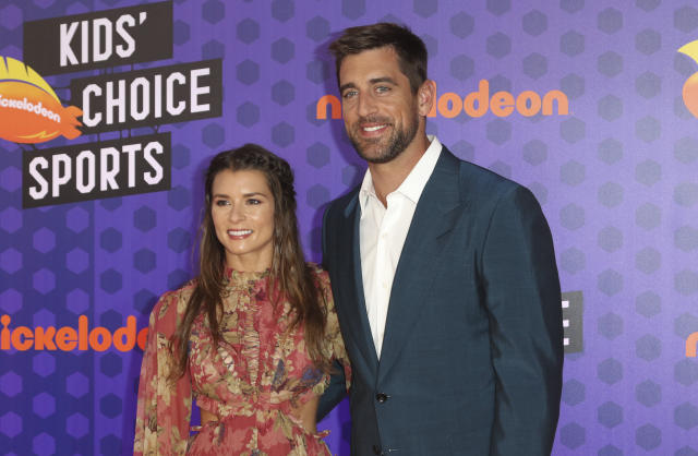 NFL football player Aaron Rodgers, of the Green Bay Packers, right, and Danica Patrick arrive at the Kids' Choice Sports Awards at the Barker Hangar on Thursday, July 19, 2018, in Santa Monica, Calif. (Photo by Willy Sanjuan/Invision/AP)