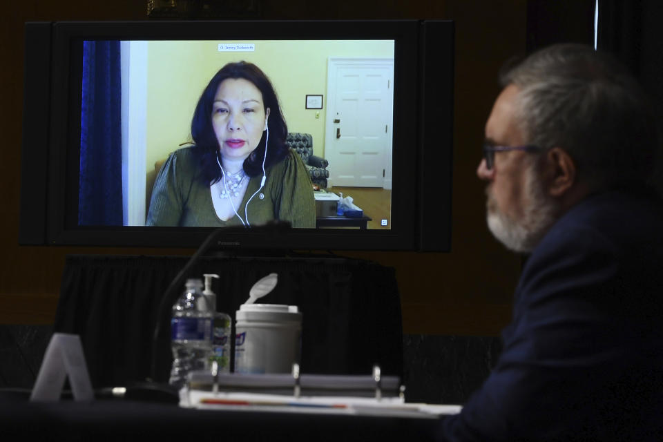 Sen. Tammy Duckworth, D-IL, speaks virtually during a Senate Environment and Public Works Committee oversight hearing to examine the Environmental Protection Agency, Wednesday, May 20, 2020 on Capitol Hill in Washington, with Andrew Wheeler, administrator of the Environmental Protection Agency, left. (Kevin Dietsch/Pool via AP)