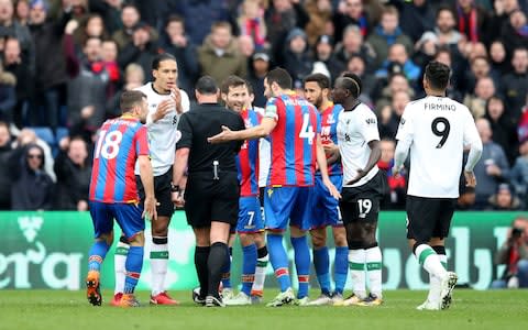Palace players were incensed that Mane was not shown a second yellow card for a deliberate handball - Credit: PA