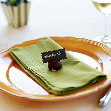 Cut a slit in a chestnut for a placecard