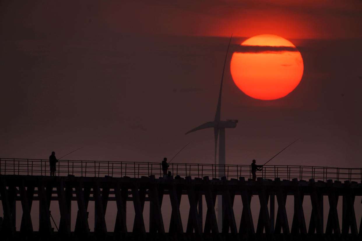 Fishermen on Blyth pier in Northumberland on Tuesday. (PA) 