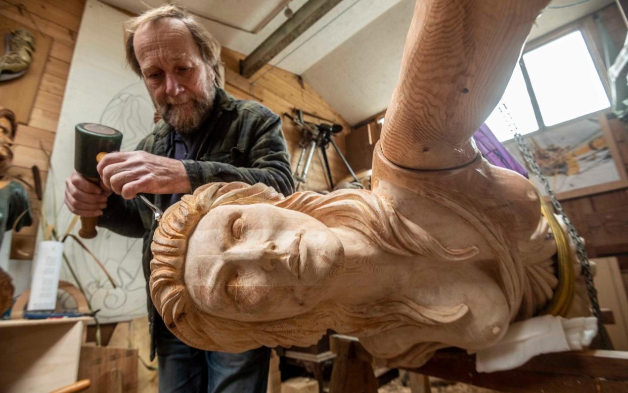 Andy Peters at work on the Cutty Sark's new figurehead - Paul Grover/The Telegraph