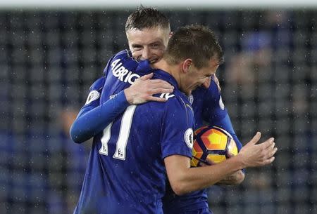 Football Soccer Britain - Leicester City v Manchester City - Premier League - King Power Stadium - 10/12/16 Leicester City's Jamie Vardy celebrates with Marc Albrighton whilst holding the match ball at the end of the match after scoring a hat-trick Reuters / Darren Staples Livepic